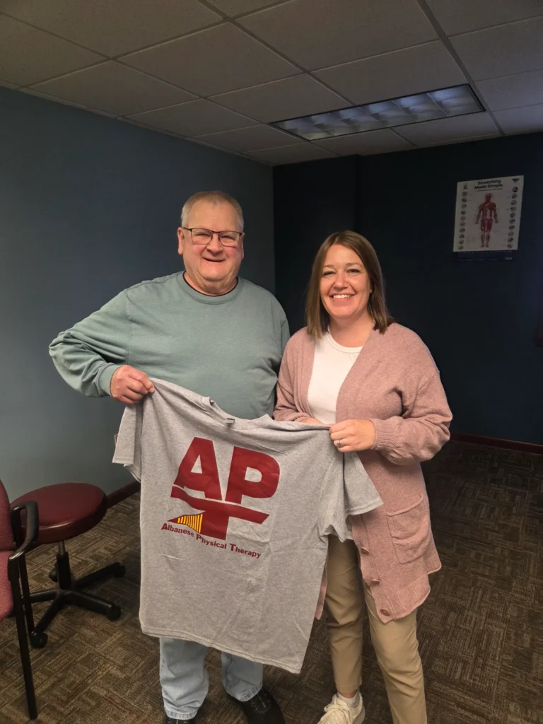 physical therapist and patient at Albanese Physical Therapy smiling together