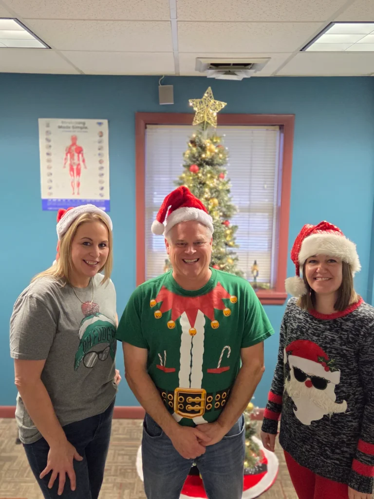 the team at Albanese Physical Therapy smiling together and celebrating Christmas