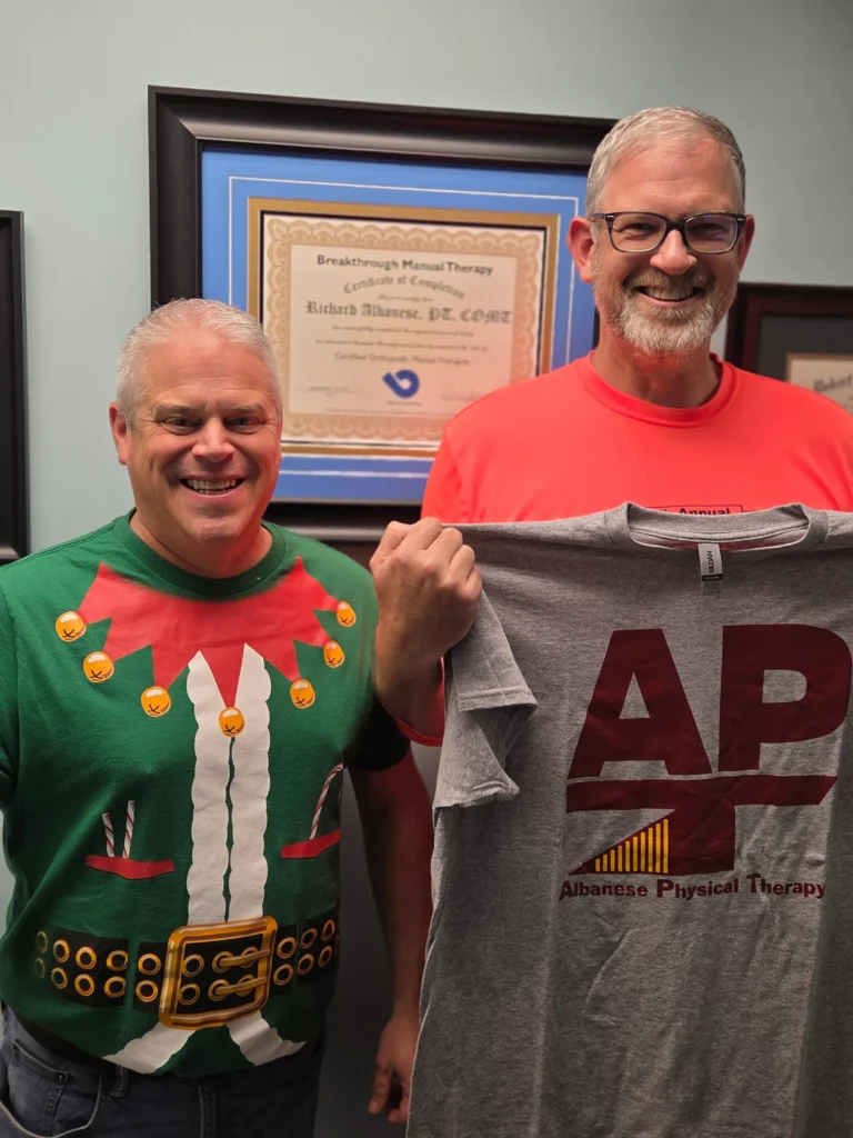 physical therapist and patient at Albanese Physical Therapy smiling together