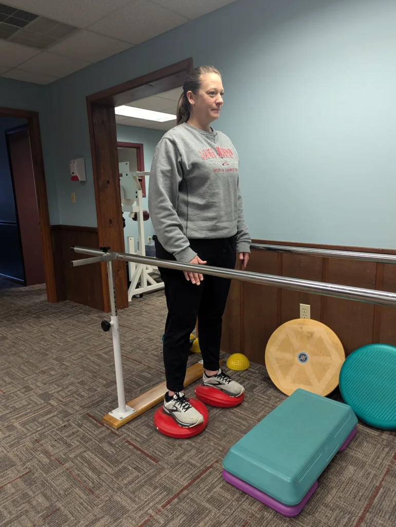 patient doing a balance exercise at Albanese Physical Therapy