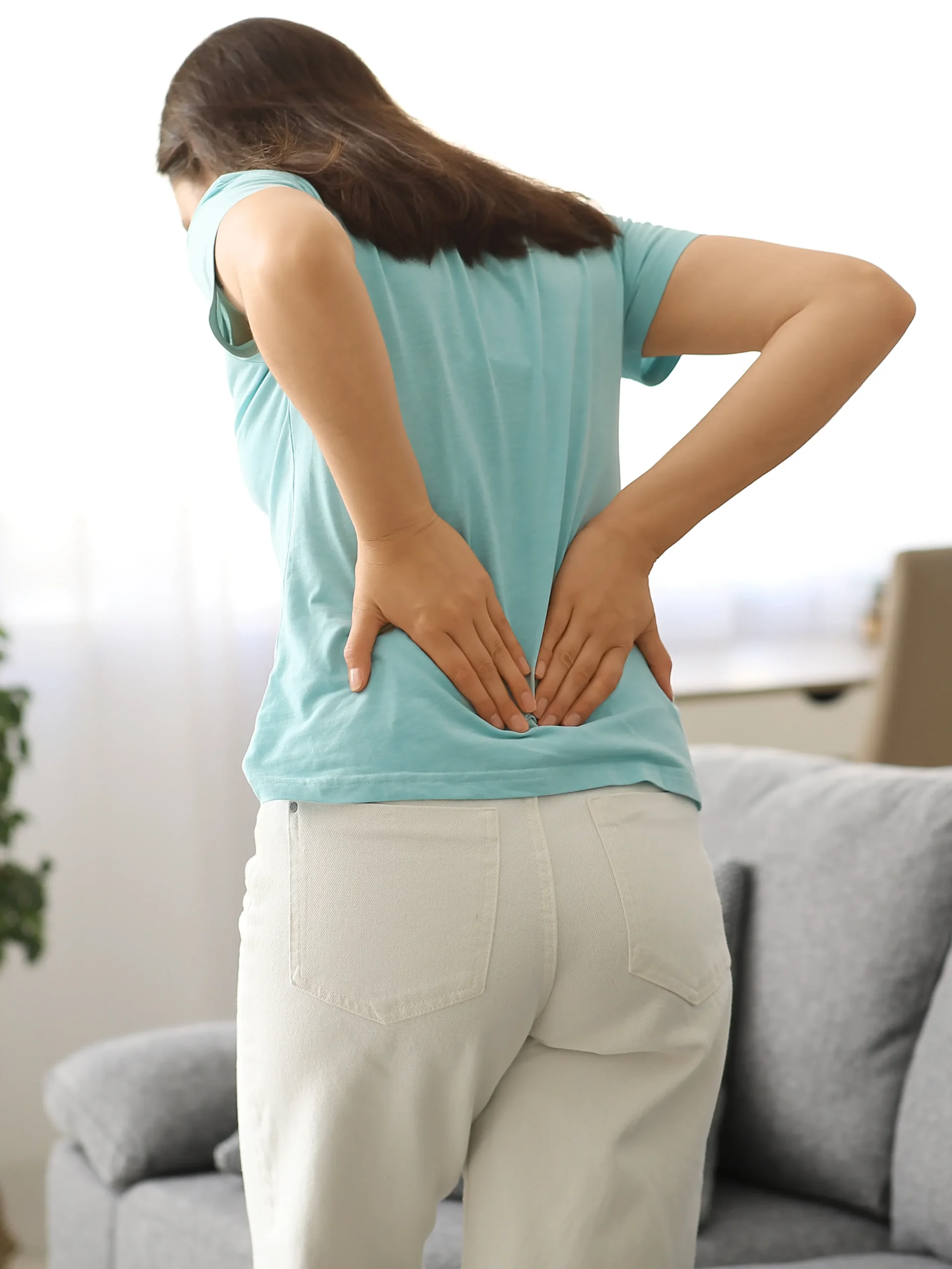 Woman showing signs of low back pain